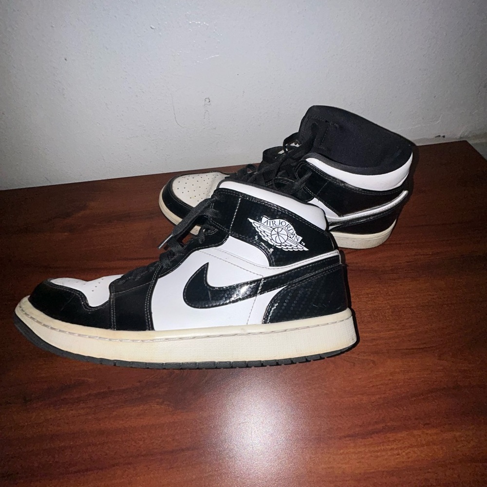 This is a Nike Air Jordan 1 Mhid SE All Star Carbon Fiber